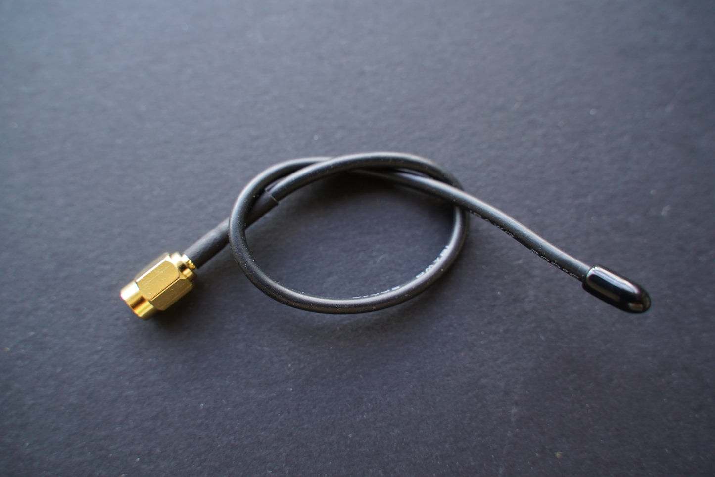 Flexible antenna for transmitters with SSMA connectors